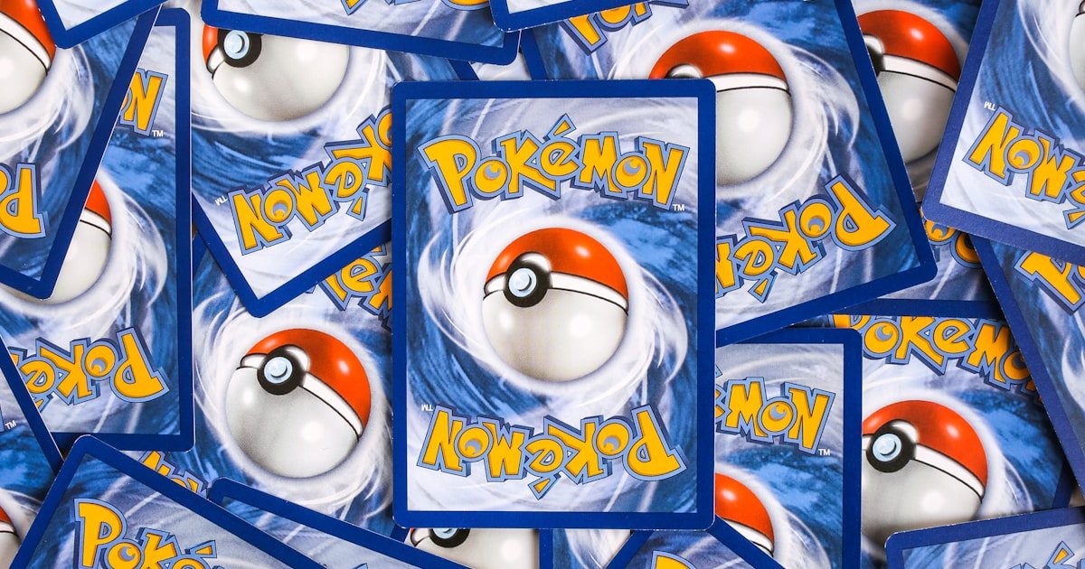 Trading cards stacked and spread out, ready to be organized into a collector binder